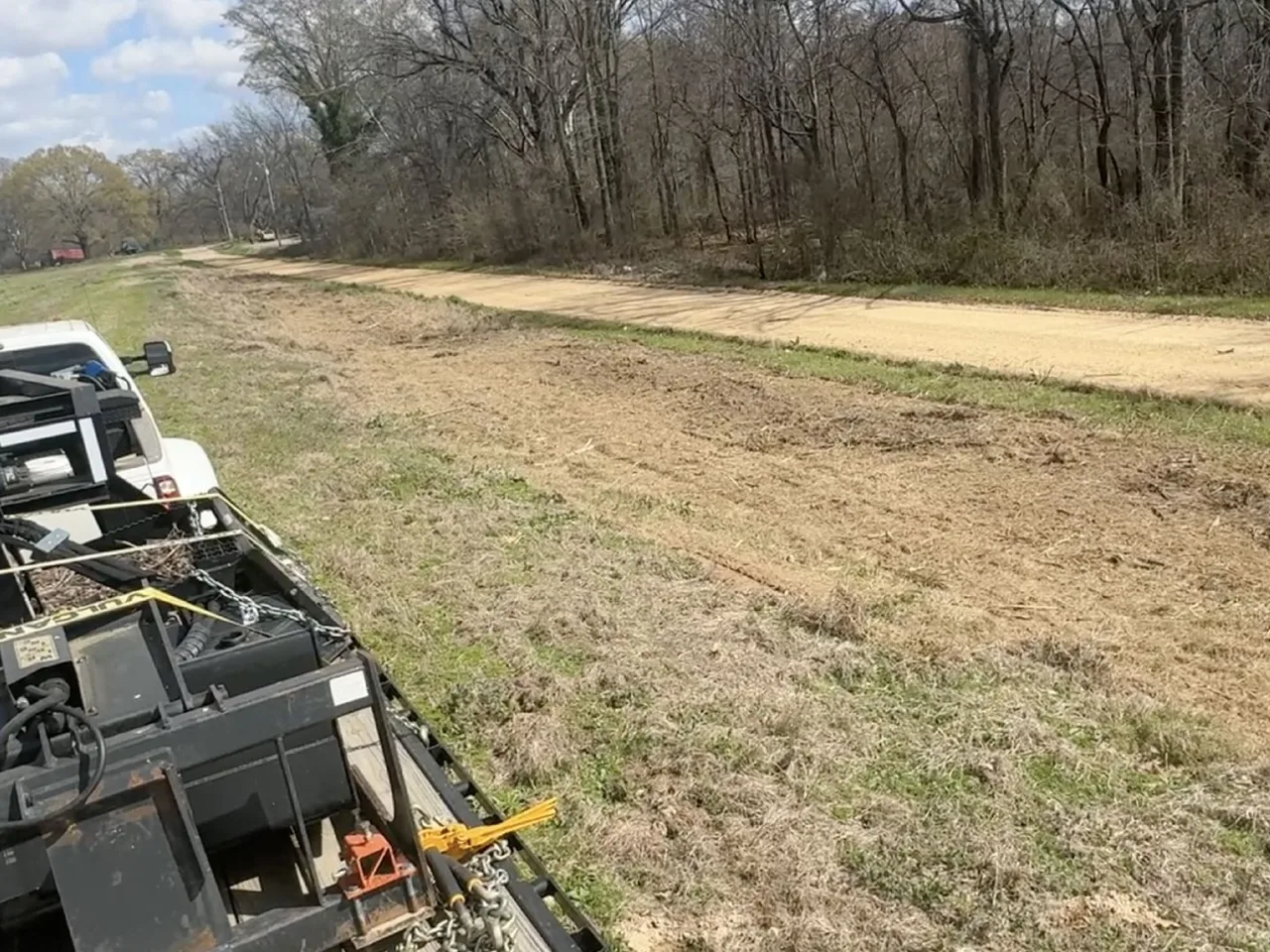 A graded and crowned dirt house pad on a cleared homesite in Northeast Louisiana