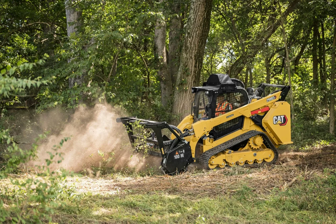 A tracked forestry mulcher grinding brush on a wooded tract in Northeast Louisiana